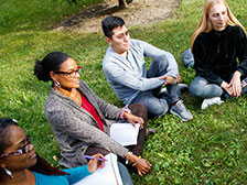 students sitting in grass students sitting in grass
