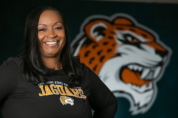 Dr. Green in front of Jax Logo