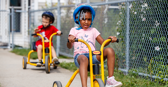 Children riding tricycles