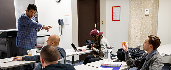 Professor having group discussion with class