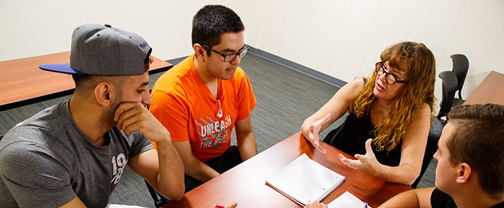 Professor talking with students