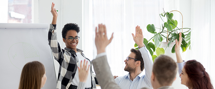 School leaders raising hands during a meeting School leaders raising hands during a meeting