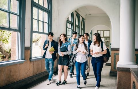 Students walking and talking in hallway