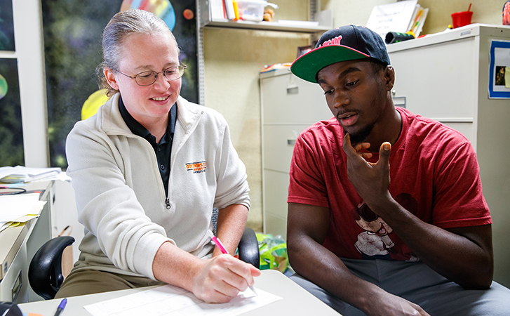 Academic advisor assisting a student