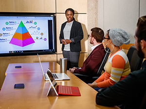 Business student giving presentation to other students