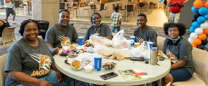 Students at table during Jaguar Leap Kickoff Event