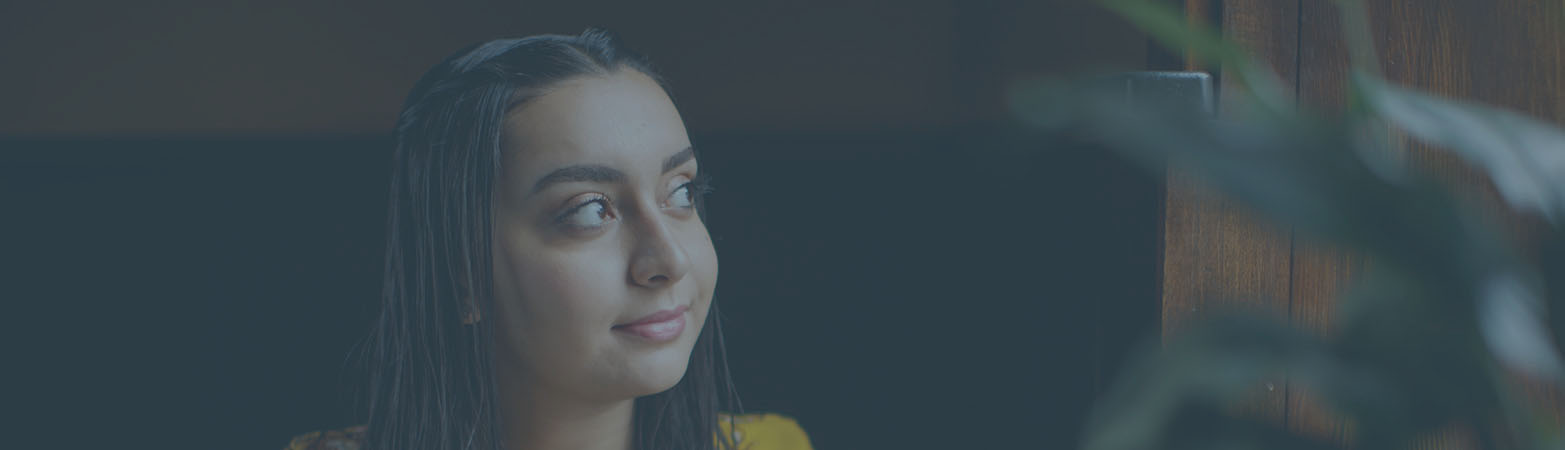 Student looking outside window
