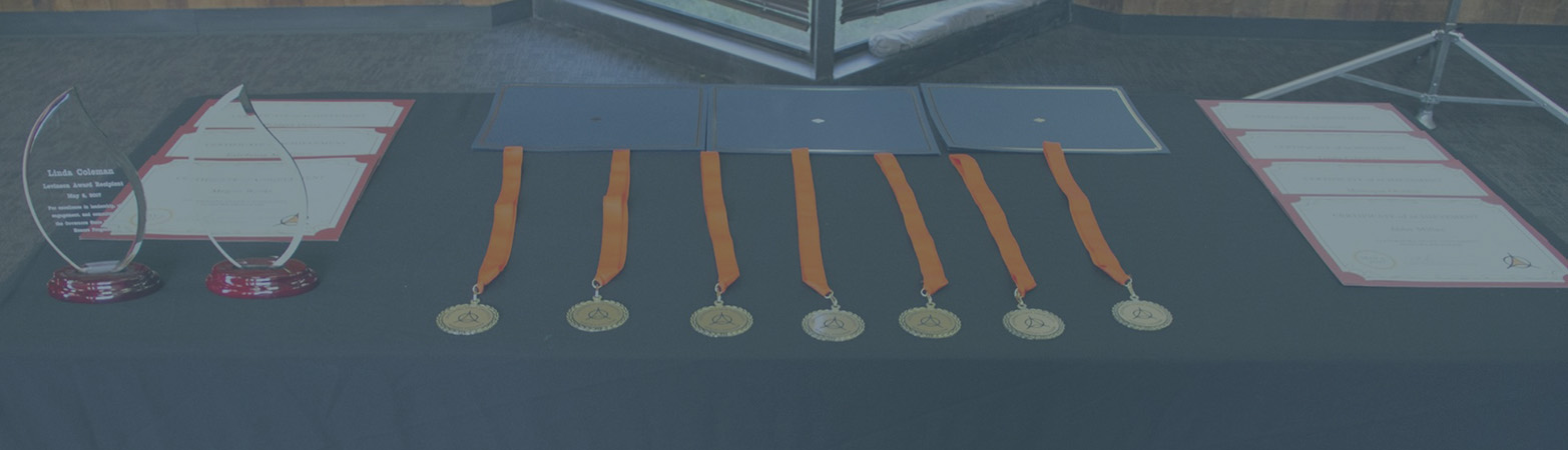 Awards for Honors College students on table