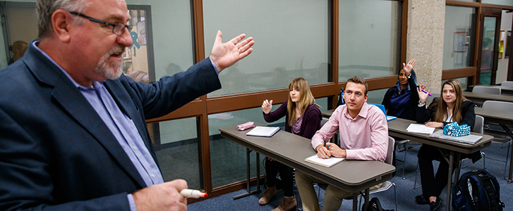Professor asking question to students Professor asking question to students
