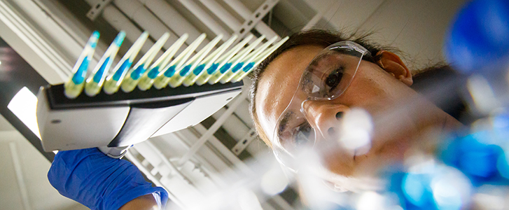 Student working with chemistry equipment