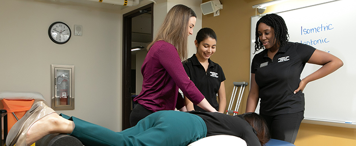 Students practicing physical therapy