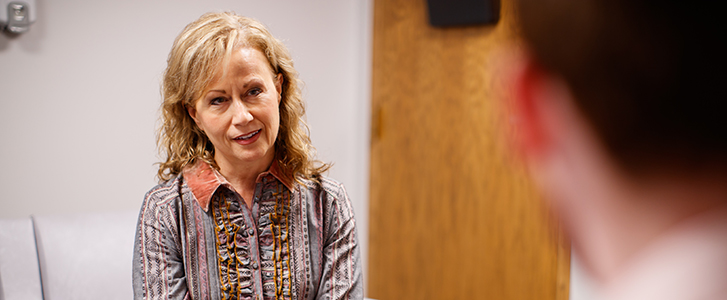 Psychologist talking with patient