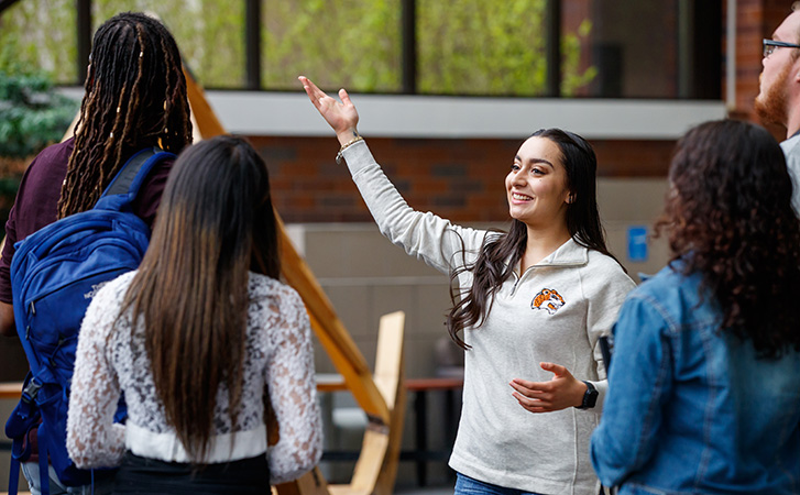 Student ambassador giving new students a tour of the campus