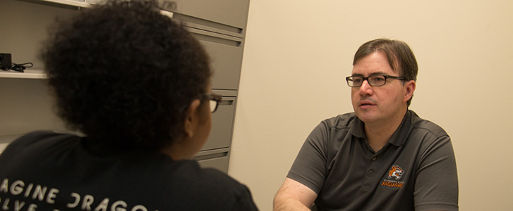 Advisor talking to student Advisor talking to student