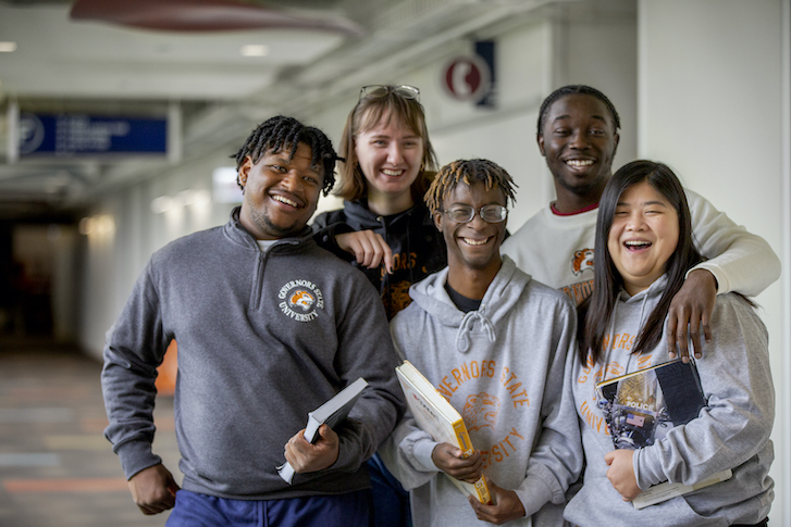 Students smiling in hallway