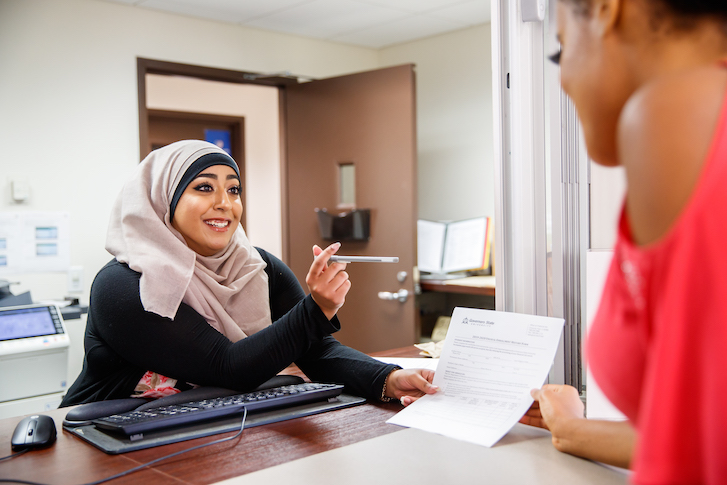 Financial Aid associate assisting student