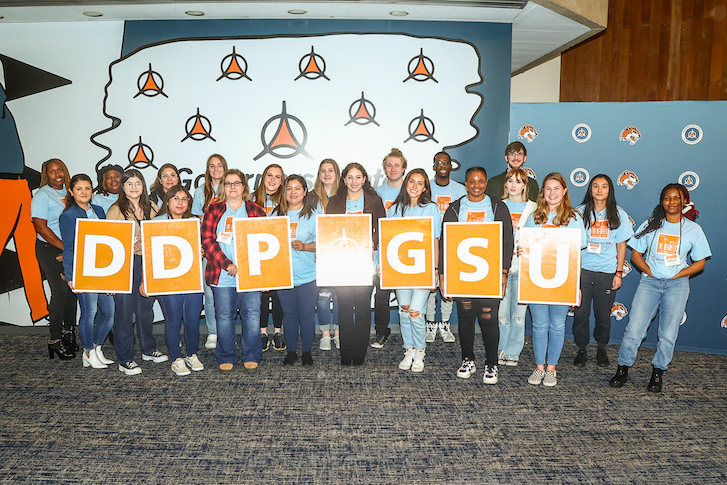DDP Students holding up DDP sign