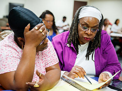2 adult students in nursing class