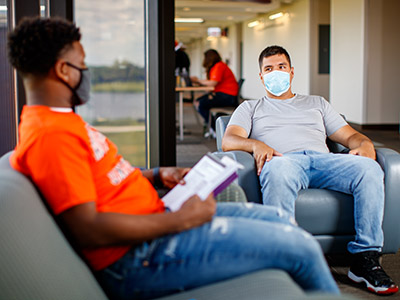 2 male students with masks