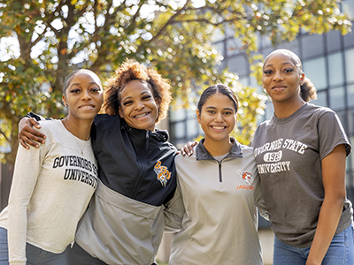 Four friends outdoors on campus