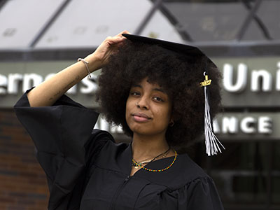 Female Grad at Front Entrance 