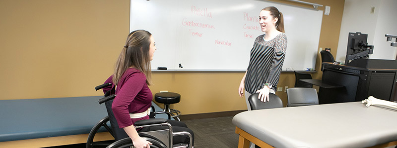 student in wheelchair in class