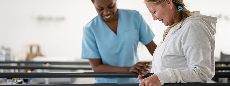 Occupational Therapy patient with parallel bars