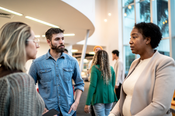 People talking at community event