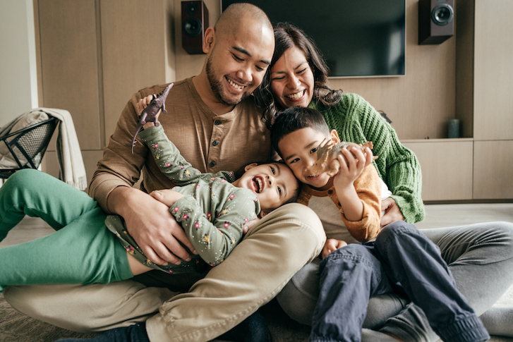 Family laughing with each other Family laughing with each other
