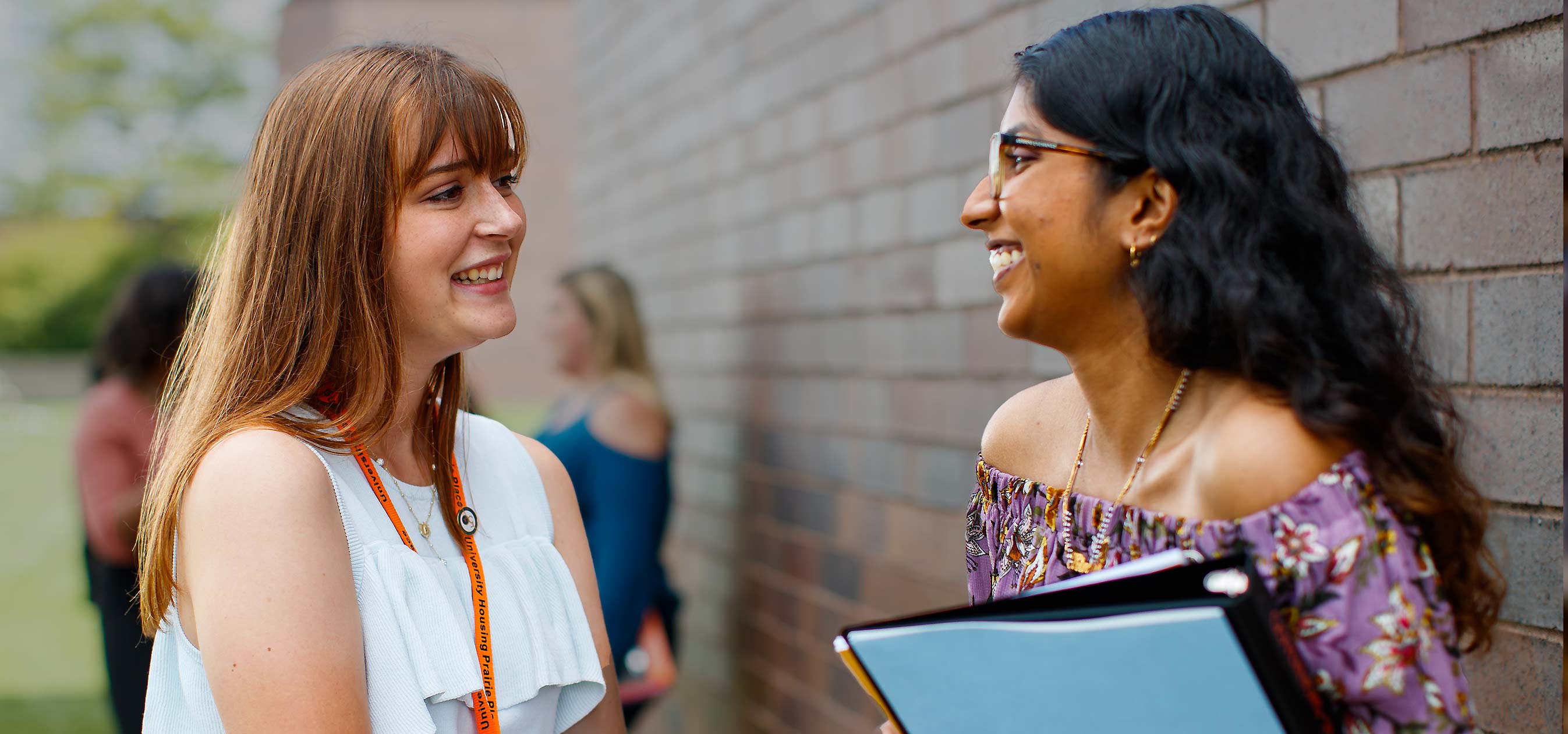 Two GSU female students talking and laughing