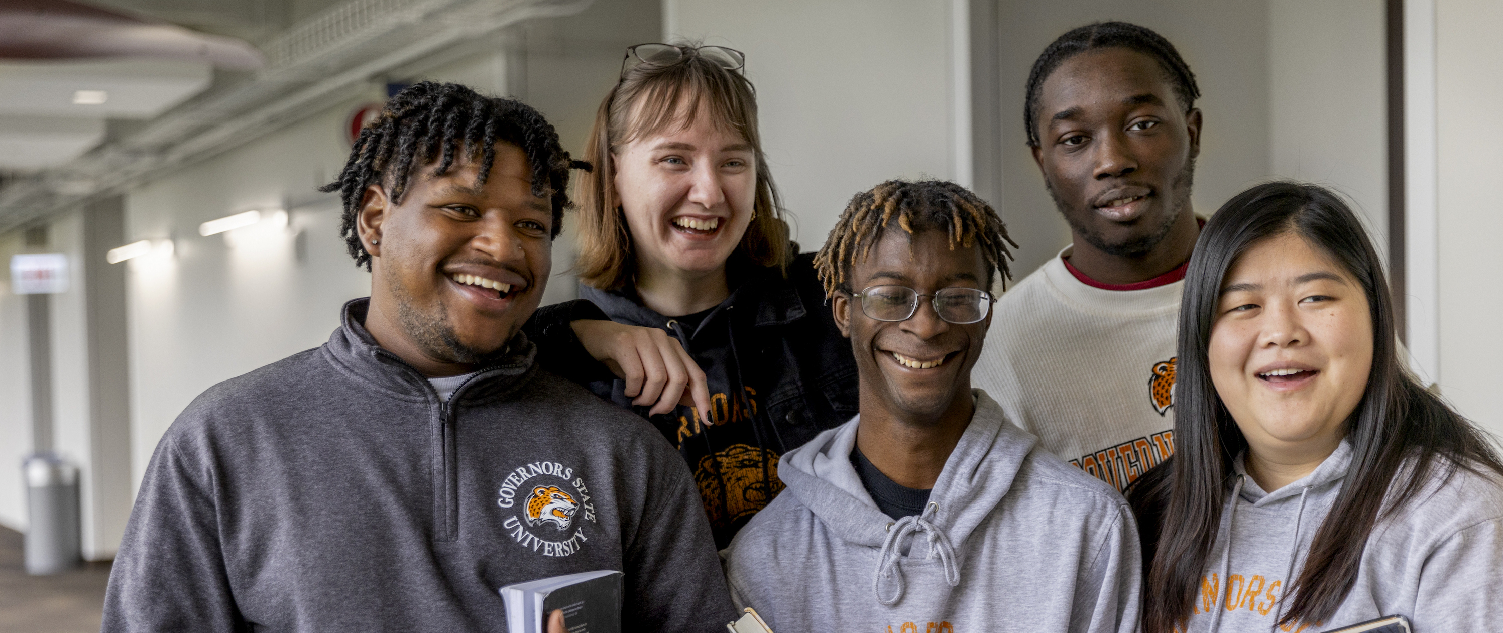 Students smiling in hallway