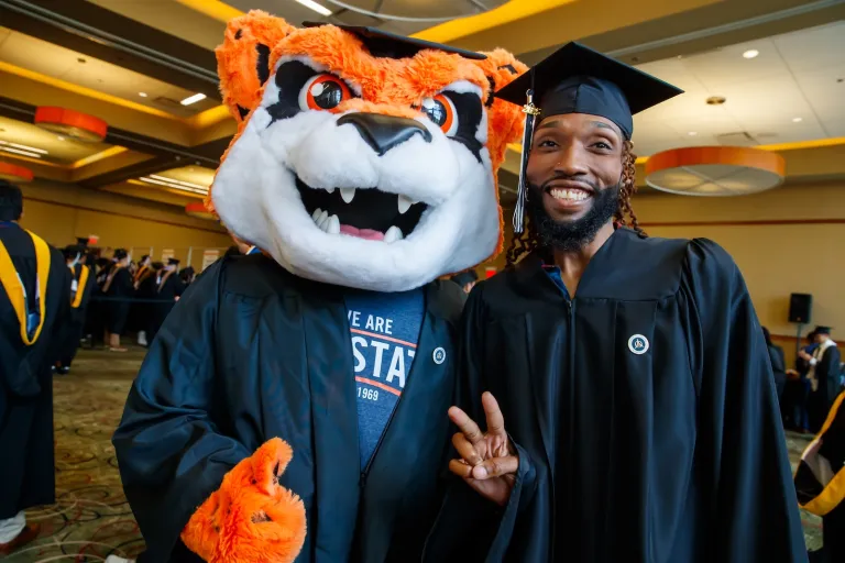 Jax with graduate at Commencement