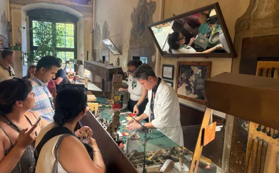 Honors College students learning traditional craftsmanship during a cultural experience in Italy.