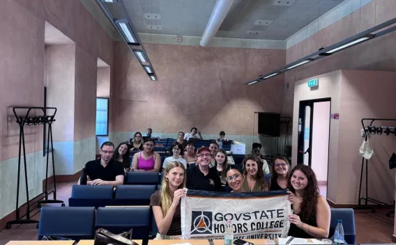 Honors College students and faculty participating in an academic session at an international partner institution during a faculty-led study abroad program in Italy.