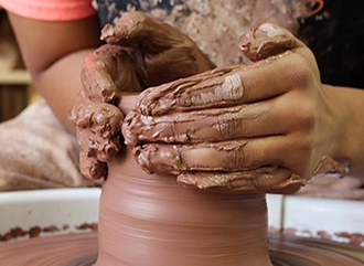 Art Major Ceramics Student Throwing