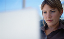 Woman looking at laptop screen