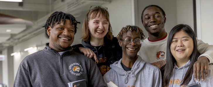 Students smiling in hallway