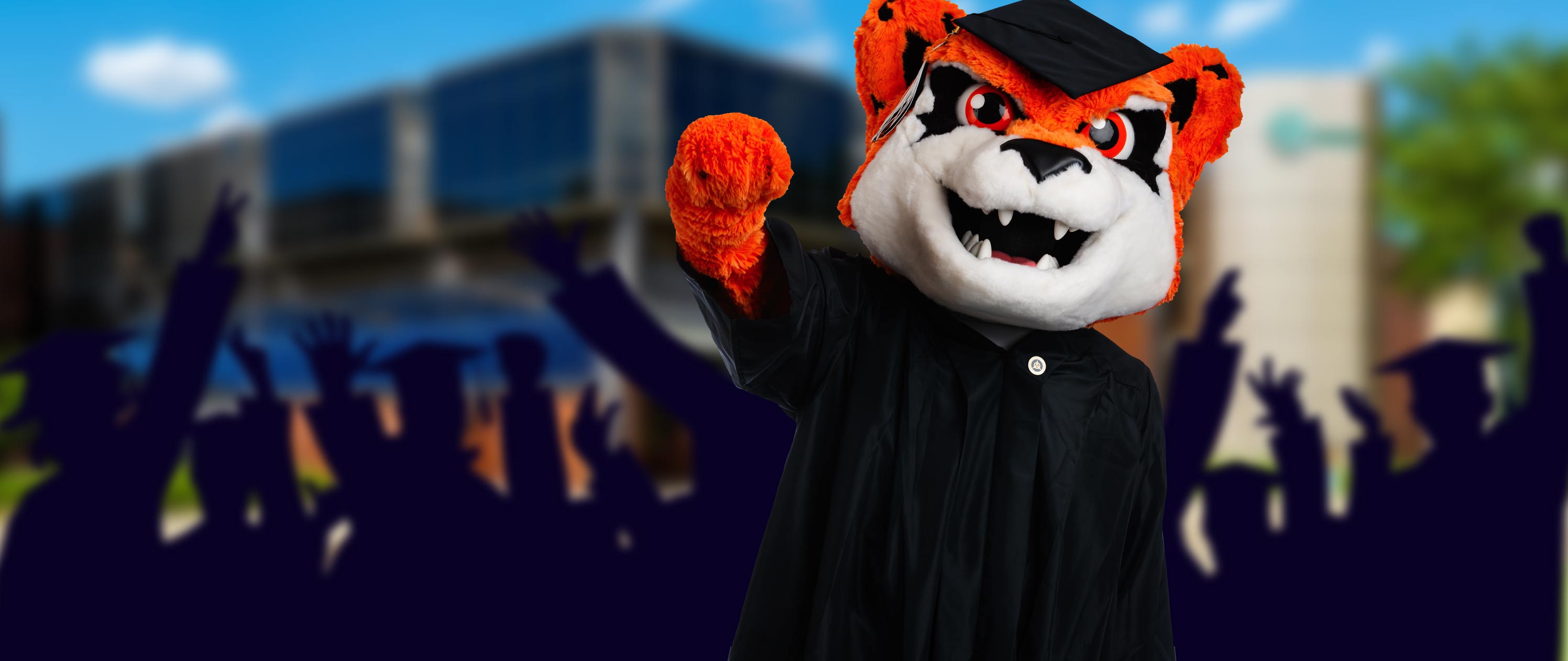 Jax wearing graduation cap and gown